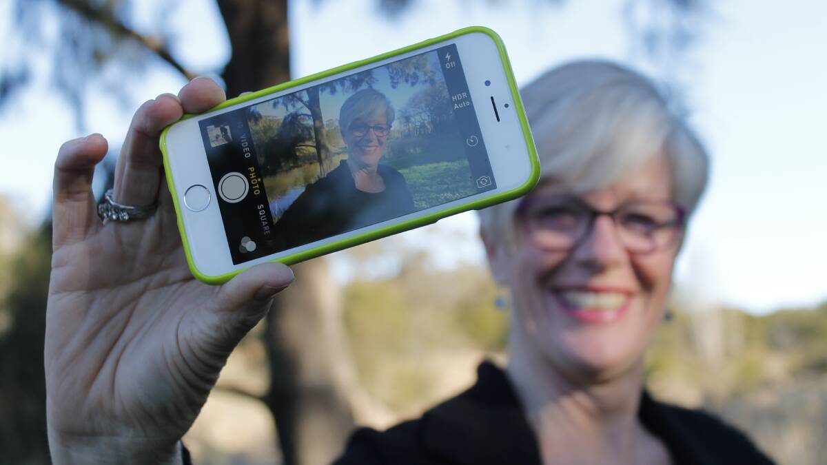 Queanbeyan resident Hilary Wardhaugh wants more local social media using #VisitQueanbeyan in a bid to create a more authentic presentation of our much maligned town. Photo: Kim Pham.