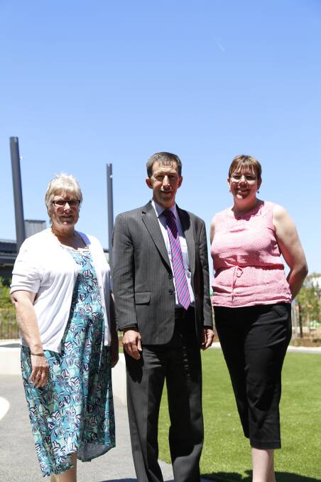 Anglicare's Sue Jennings with the Anglican School Googong Early Learning Centre director Rose Young and principal Ian Hewitt exploring the outdoor areas. Photo: Kim Pham.