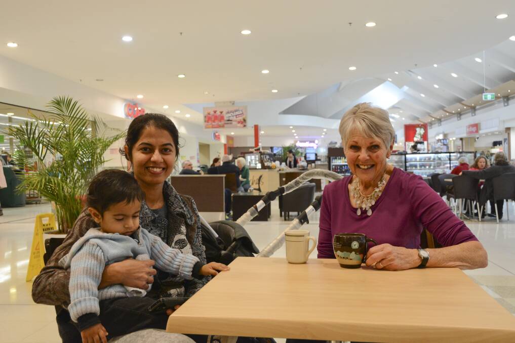 Neha Thakkar, with her 14-month-old son Jayval, has recently arrived in Australia from India. She discussed contributing to an information booth at the River Festival in October with Rural Australians for Refugees Queanbeyan advocate Alison Charlton. Photo: Ron Aggs.