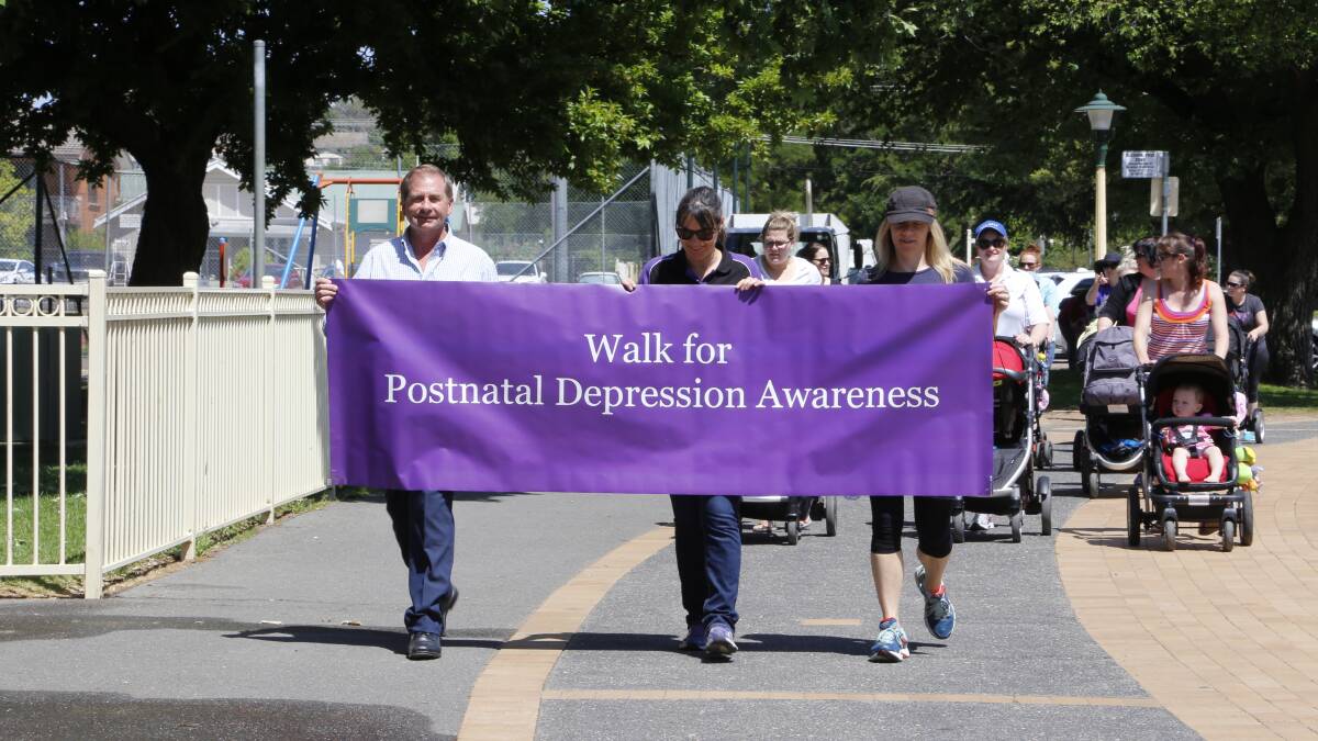 More than 100 community members including Queanbeyan Mayor Tim Overall (left) took part in the walk for Postnatal Depression awareness on Wednesday. Photo: Kim Pham.