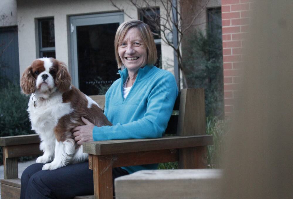 HOME in Queanbeyan manager Anne Pratt, pictured with Benny, is passionate about working with those who suffer with mental illness. Photo: Kim Pham.
