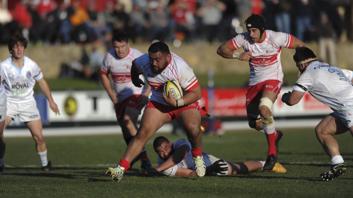 Vikings prop Phil White charges through Queanbeyan defenders. Photo: Graham Tidy, The Canberra Times.