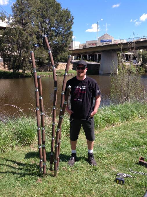 Artist Chris Harman with his piece 'Reed Specimen in Memory of Frank Schmidt' which won the Clearwater Sculpture Prize. Photo: supplied.