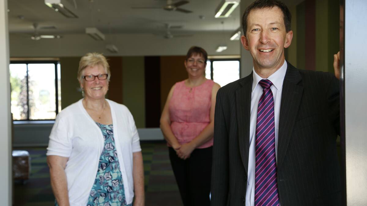 Anglicare's Sue Jennings with the Anglican School Googong Early Learning Centre director Rose Young and principal Ian Hewitt exploring the school's first completed building. Photo: Kim Pham.