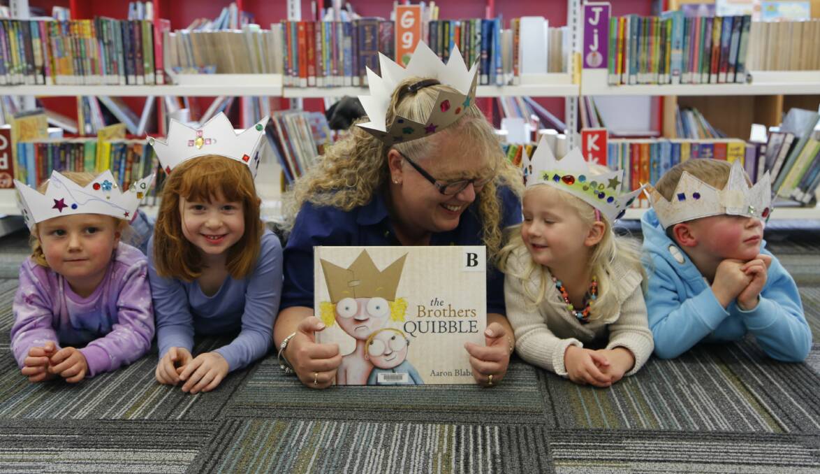 Natalie Shea, Annika Holder, assistant children's librarian Emma Ciechan, Sarah Cotter and Harris Rhule teamed with the theme for National Simultaneous Story Time. Photo: Kim Pham.