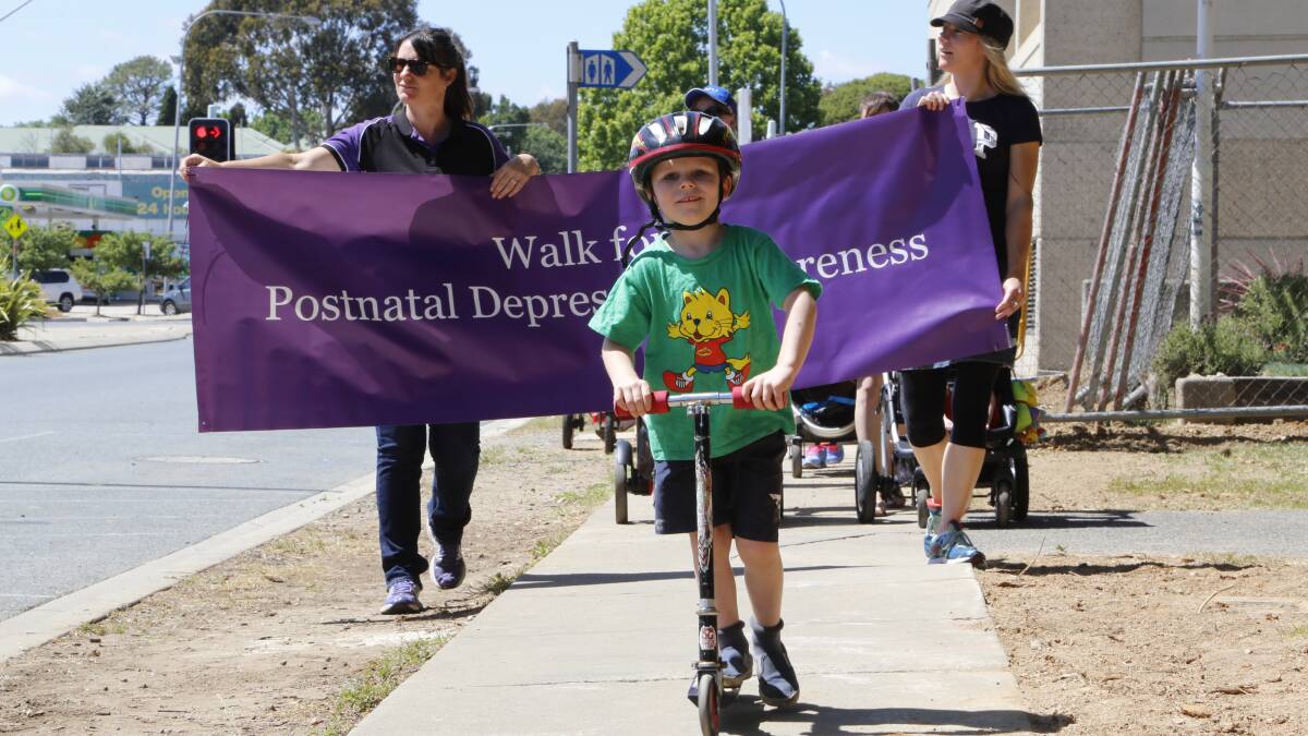 More than 100 community members including Queanbeyan Mayor Tim Overall (left) took part in the walk for Postnatal Depression awareness on Wednesday. Photo: Kim Pham.