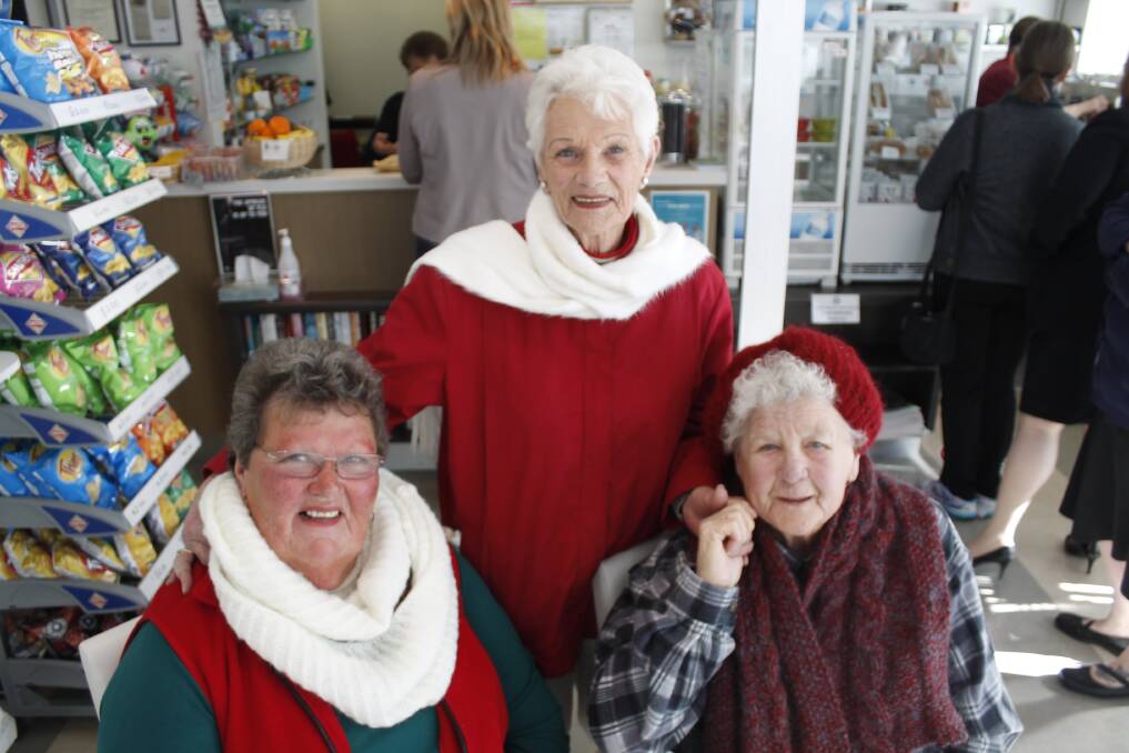 Queanbeyan Hospital Auxiliary volunteers Nerida Murphy, Nola Horton and Tui Dawes are looking forward to their very first Christmas in July market. Photo: Kim Pham.