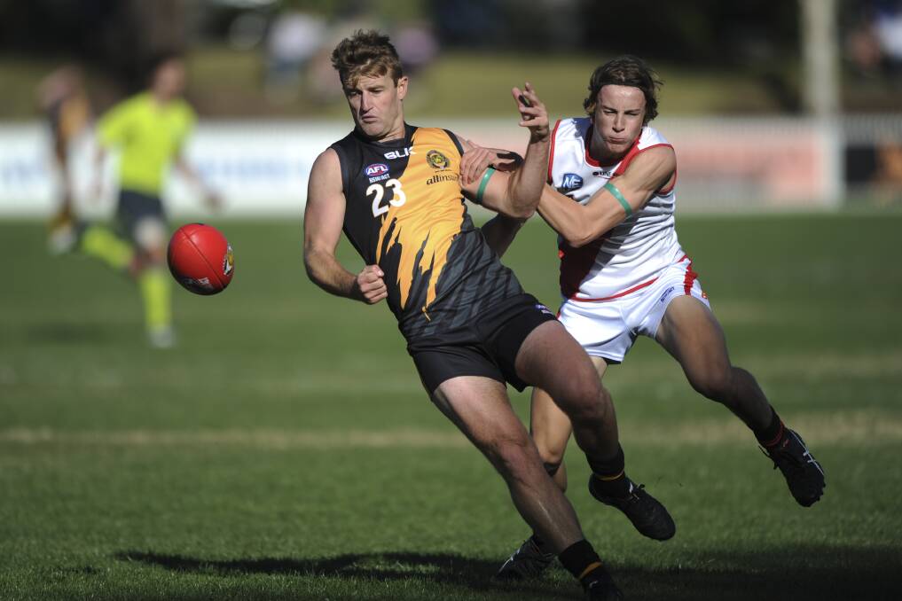 Queanbeyan's Brett Fruend is tackled by Eastlake's Nick Anderson. Photo: Graham Tidy.