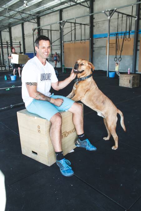 Queanbeyan CrossFit owner and operator Kane Cawse and his dog Chad. Photo: Gemma Varcoe.