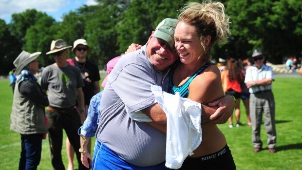 Sophie Broadhead and coach Dennis Goodwin celebrate her win in the women's Queanbeyan Gift. Photo: Melissa Adams.