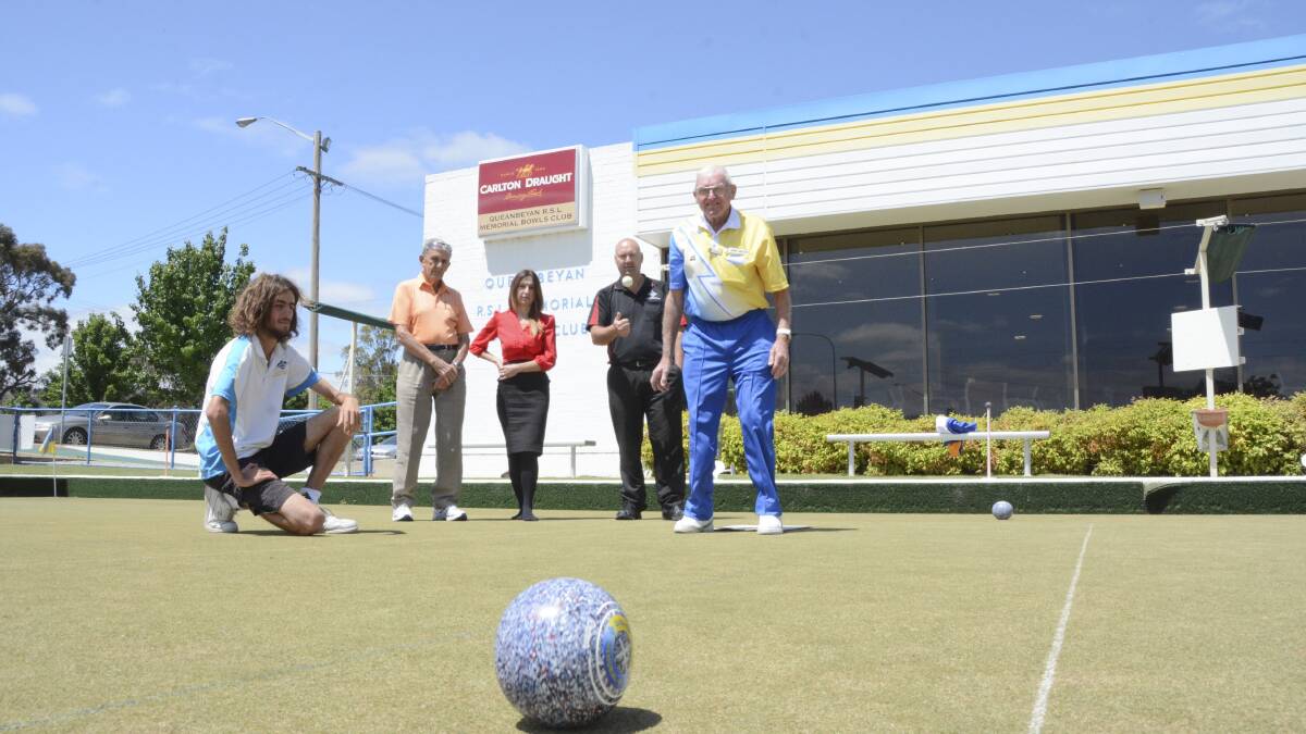 Nathan Savino watches coach Jack Dicker roll one at the camera while club members Arty Walters, secretary-manager Marta Kavas and ACT Sport Hall of Famer Adam Jeffery judge his target practice. Photo: Ron Aggs.