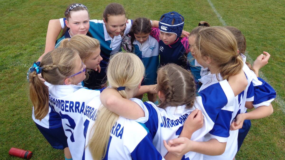 The girls huddle prior to their last match. Photo: Jason Fuller.