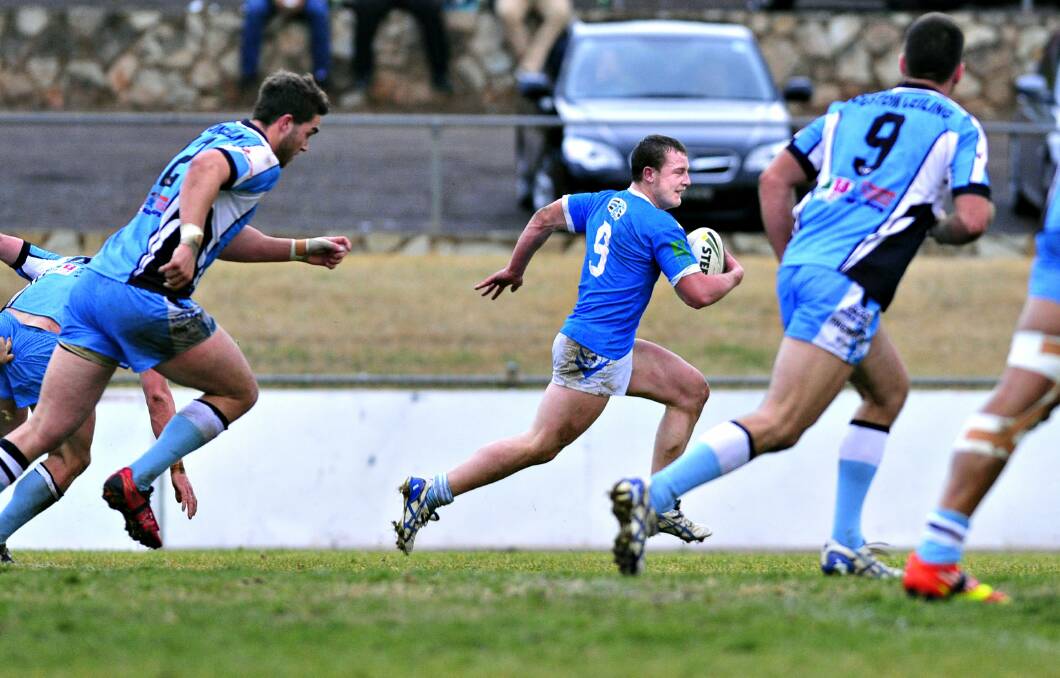 Josh Chudleigh makes a break while playing for the Queanbeyan Blues in 2013. Photo: Jeffrey Chan.