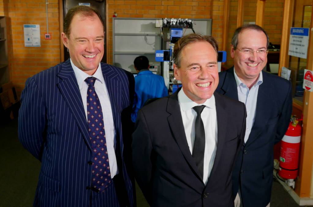 Managing director of Dyesol Richard Caldwell, Environment Minister Greg Hunt MP and Federal Member for Eden-Monaro Dr Peter Hendy MP at Dyesol in Queanbeyan. Photo: Amanda Copp. 
