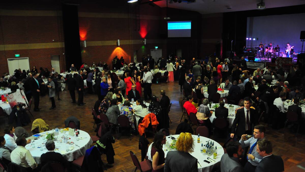 The charitable crowd mingles at Bicentennial Hall. Photo: Supplied.