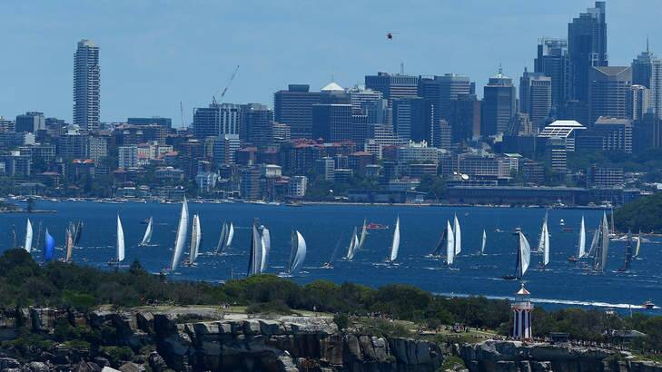 The fleet moves away from the start line during the 2013 Sydney to Hobart on December 26, 2013 in Sydney, Australia. Photo: Joosep Martinson, Getty Images.