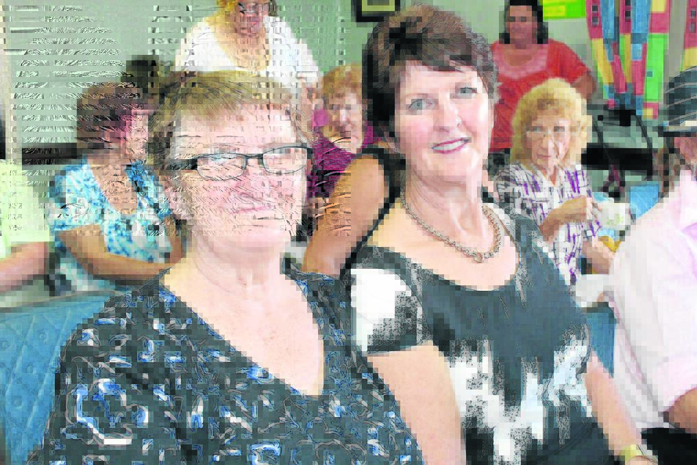Beaudesert's Sylvia Hickey caught up with Canungra 
woman Margo Wood at the CWA cent auction.