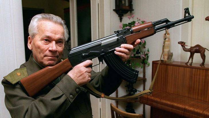 Gun creator ... Mikhail Kalashnikov shows a model of his world-famous AK-47 assault rifle at home in the Ural Mountain city of Izhevsk in 1997.