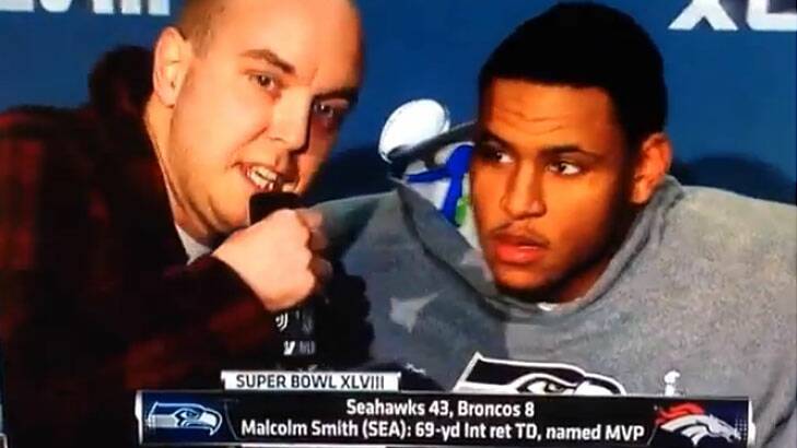 9/11 conspiracy theorist Matthew Mills crashed a television interview with Super Bowl MVP Malcolm Smith.
