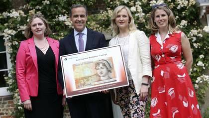 Conservative member of parliament Mary Macleod (L-R), Bank of England Governor Mark Carney, Labour and Co-operative member of parliament Stella Creasy and Women's Room co-founder Caroline Criado-Perez pose for a photo with the concept design for the new 10 pound note, featuring British 19th century novelist Jane Austen, at the Jane Austen House Museum in Chawton, near Alton, July 24, 2013. Austen will become the face of the new 10 pound note, the Bank of England said on Wednesday, defusing criticism that women are under-represented on the country's currency. REUTERS/Chris Ratcliffe/Pool (BRITAIN - Tags: BUSINESS POLITICS) Photo: POOL