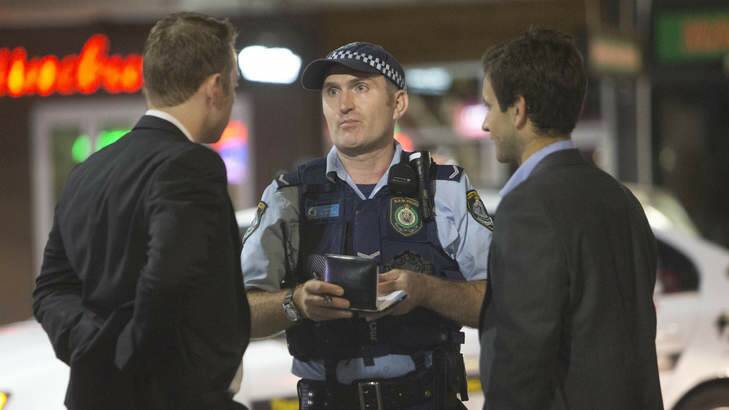 Police talk to Kings Cross patrons who "fail to quit" on the first weekend of the new 1.30am lockout rules Photo: Steve Lunam