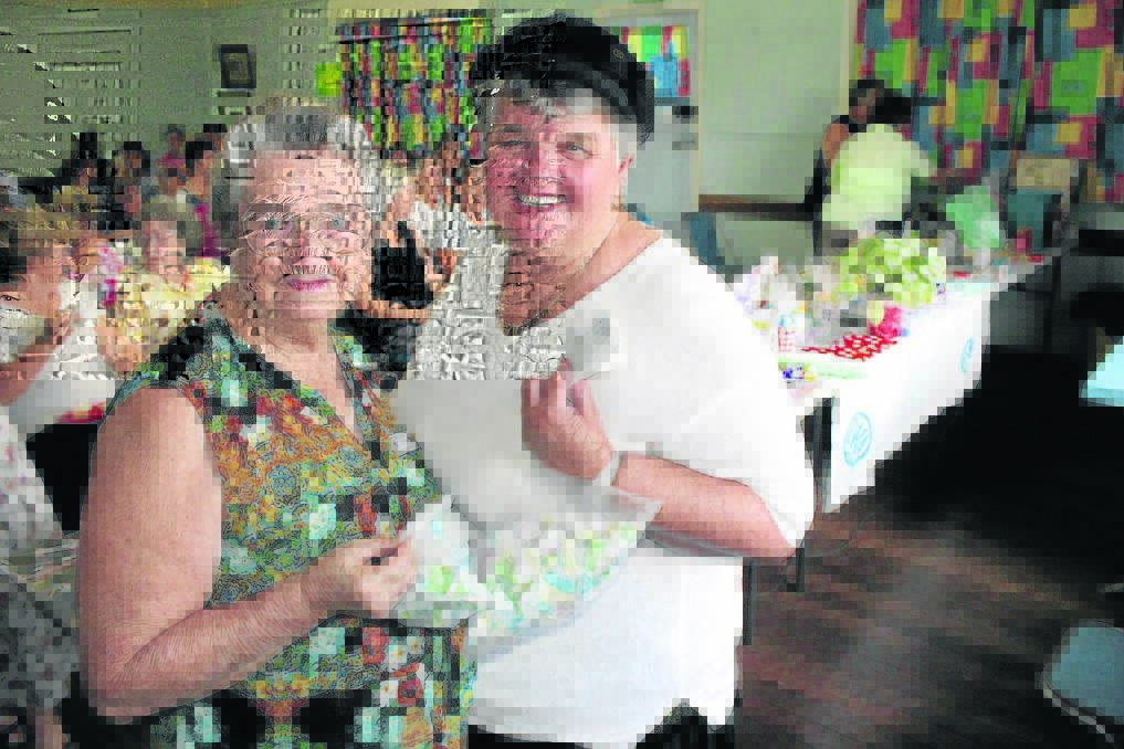 Beaudesert women Margaret Greer and Joan Quick were ready to go with their cent auction tickets.