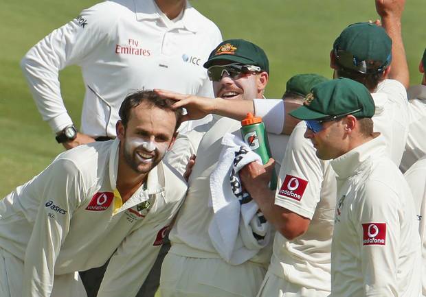 ADELAIDE, AUSTRALIA - NOVEMBER 25:  Nathan Lyon of Australia is congratulated by his team mates after dismissing Jacques Rudolph of South Africa during day four of the Second Test Match between Australia and South Africa at Adelaide Oval on November 25, 2012 in Adelaide, Australia.  (Photo by Scott Barbour/Getty Images)