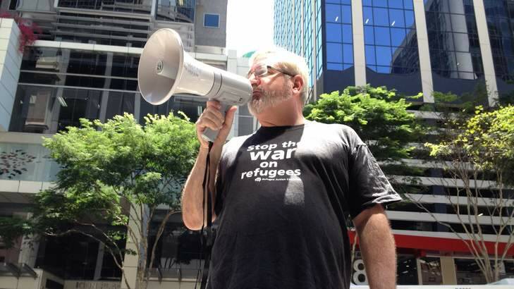 Former senator Andrew Bartlett addresses a Brisbane protest calling for the closure of the Manus Island detention centre. Photo: Ashley Mackinnon