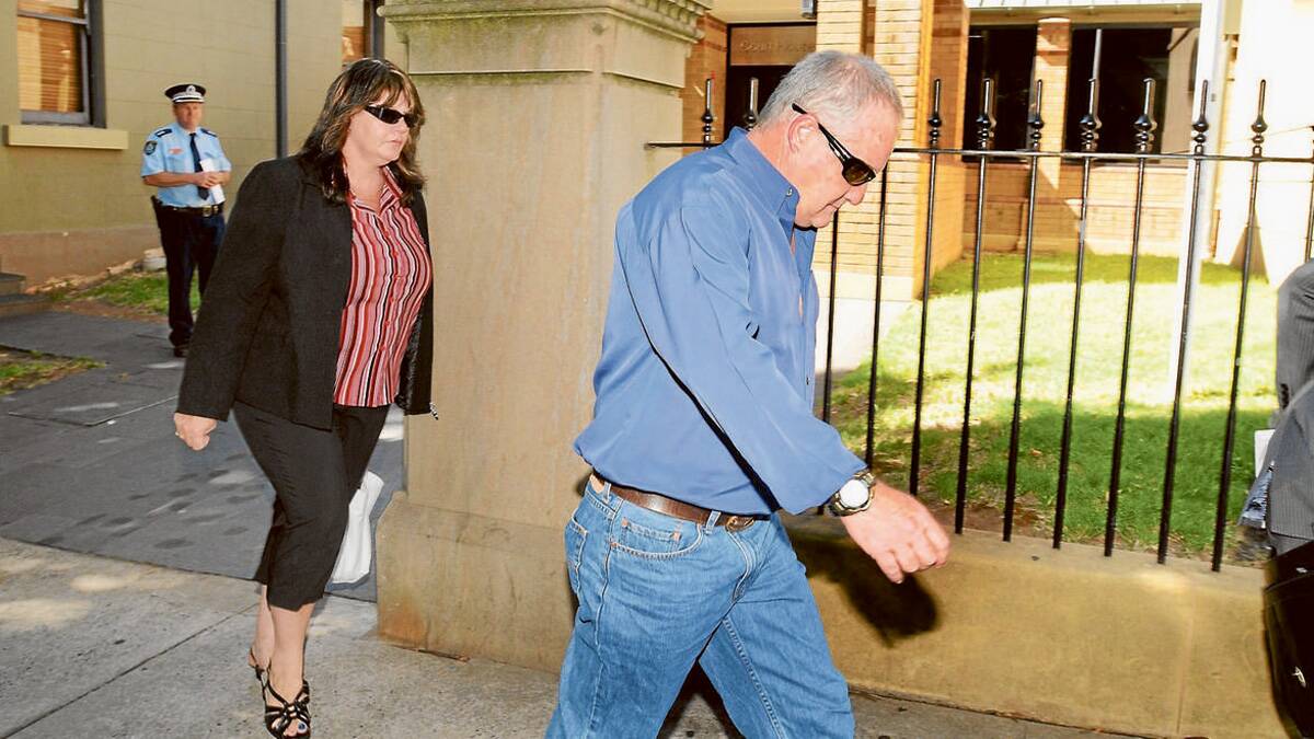 SAD CASE: After spending the night at the police station with her son, the mother of a man accused of critically injuring another man with a punch to the head leaves Orange Local Court yesterday with her partner following a bail hearing. Photo: STEVE GOSCH  