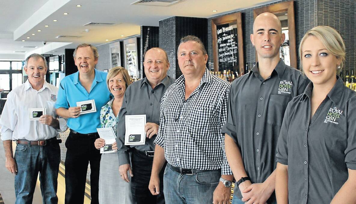 (From left) Richard Maloney of the Queanbeyan Whites, Peter Day and Anne Pratt of HOME in Queanbeyan, and Jim Cooper of Queanbeyan City Travel and Cruise join with Royal Hotel owner Peter Griffiths and managers Guy Filmer and Alex Maas to launch the new Royalty Card on Monday. 