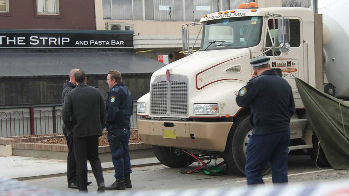Queanbeyan Police at the scene of the fatal collision between a pedestrian and cement truck. | Photo: Kim Pham.