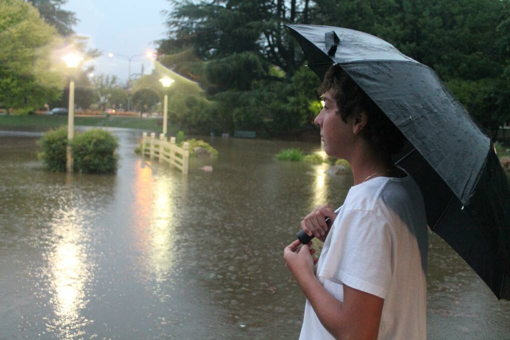 George Solomon looks out over a flooded Town Park. 