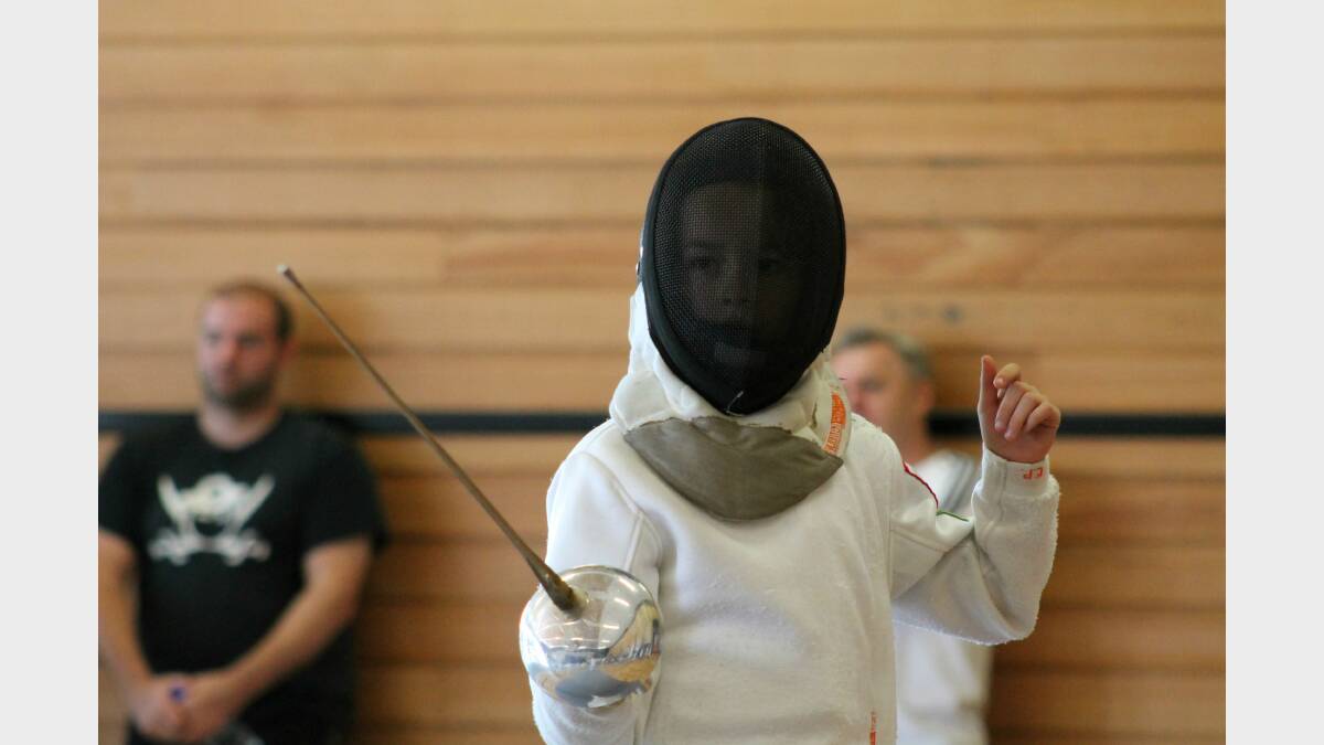 Juliet Sykes readies for her bout against Matthew Cobb in the under-11s. Photos: Andrew Johnston, Queanbeyan Age