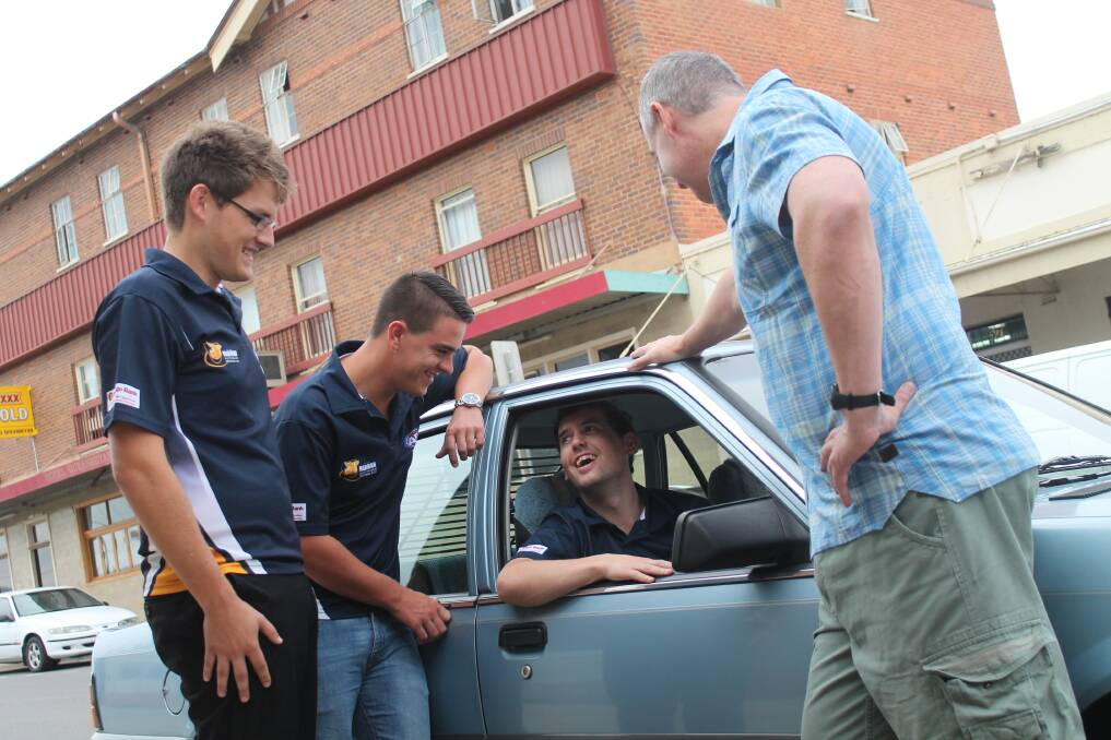 Harman Hogs members Brad Toone (left), Josh Prater and Top Pub publican Mathew Griffin with Johno Carbone in his new 1987 VL Holden. The car was paid for by members of the community after Carbone's prized 1986 VL was stolen from outside his Queanbeyan residence earlier this month. Photo: Andrew Johnston
