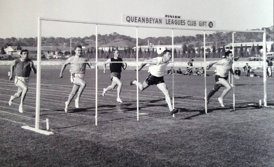 President of NSW Athletics League Ken English (far right) crosses the finishing line of the Queanbeyan Men's Gift in 1968.  