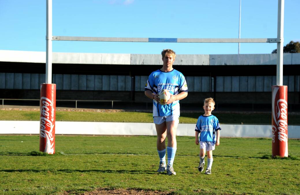 Queanbeyan Blues prop Jay Lasscock with son and Blues junior Cooper last year. Photo: Elesa Lee