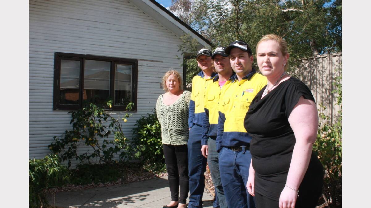 Jay and Samantha Lasscock's neighbours Renee Smith (front) and Donna Flack along with Jay's Essential Energy workmates Baden Berger, Darren Archer and Jarrod Conway are helping the family finish off their home renovations in the wake of Jay's passing.