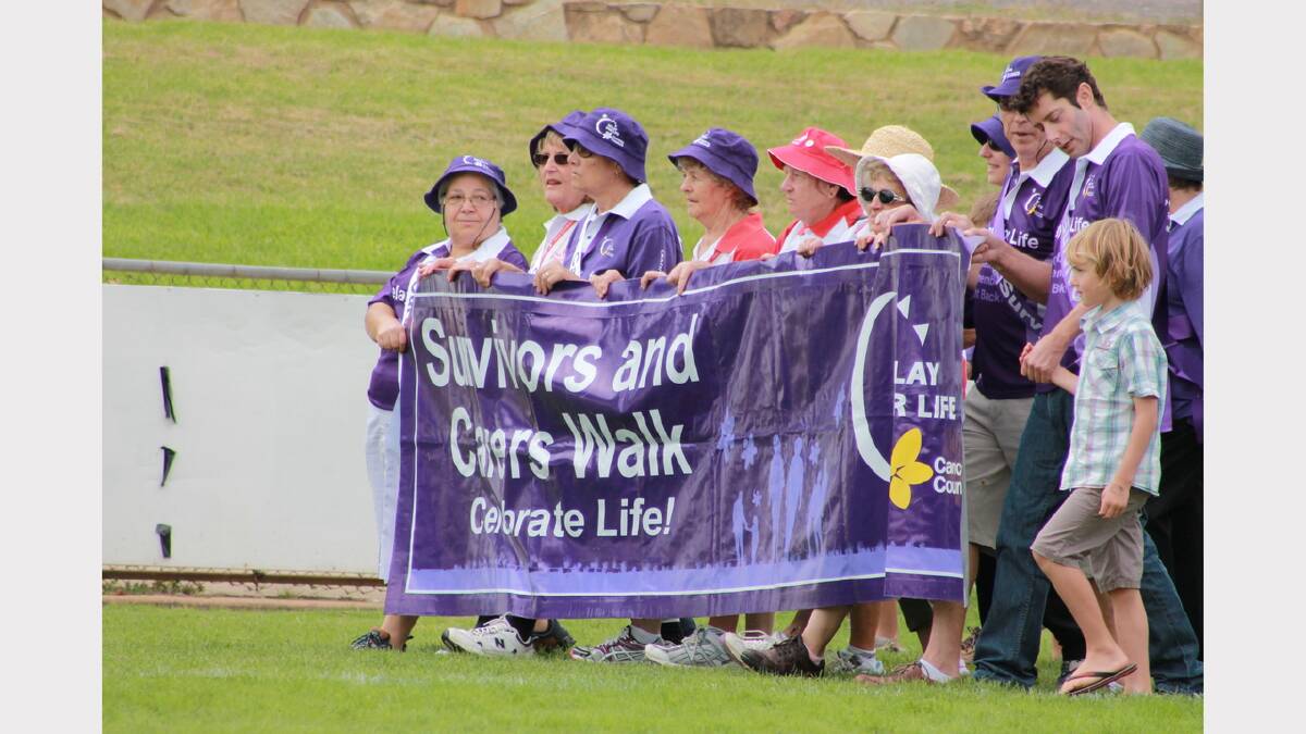 Relay for Life 2013 kicks off with a ceremonial lap of Seiffert Oval, led by cancer survivors and carers. PHOTO: Kim Pham