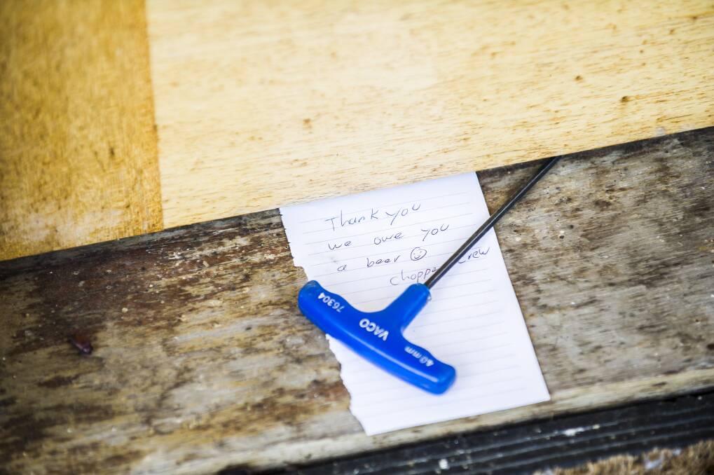 A note left by the RFS at a home on Hazeldell Rd, near Bungendore, after the residents lent the helicopter crew a tool to repair the helicopter on January 9, 2013. Photo: Rohan Thomson. 