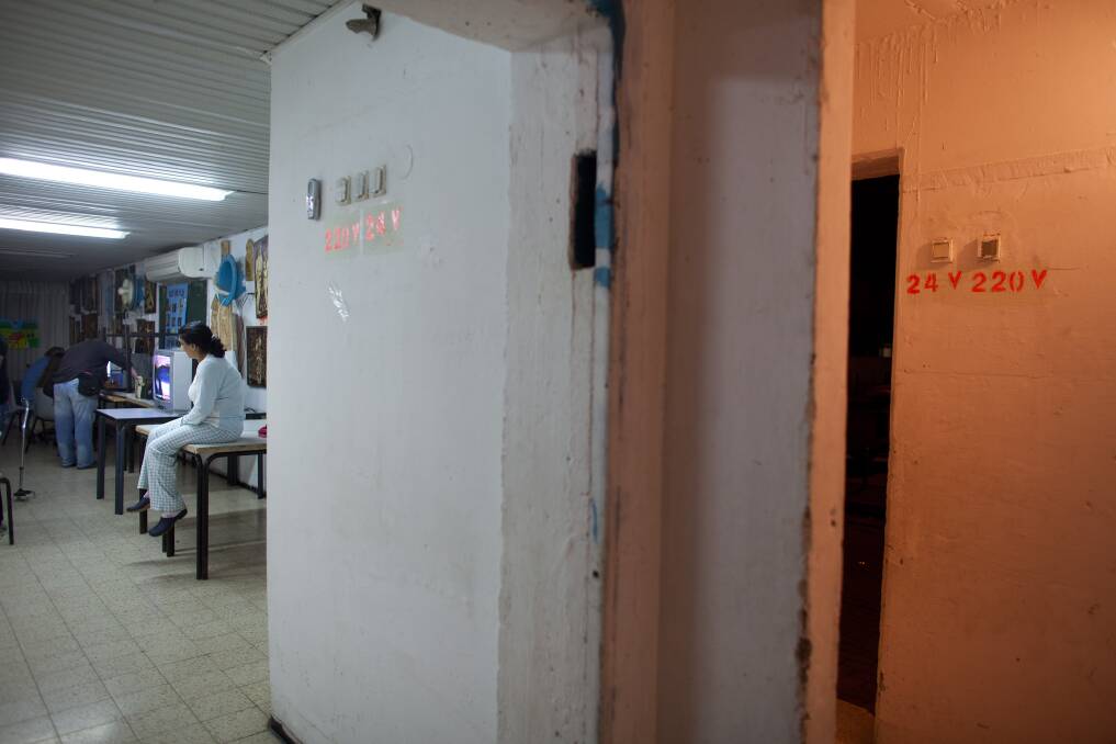 Israelis watch TV in a bomb shelter on November 14, 2012 in Netivot, Israel. Photo by Uriel Sinai/Getty Images