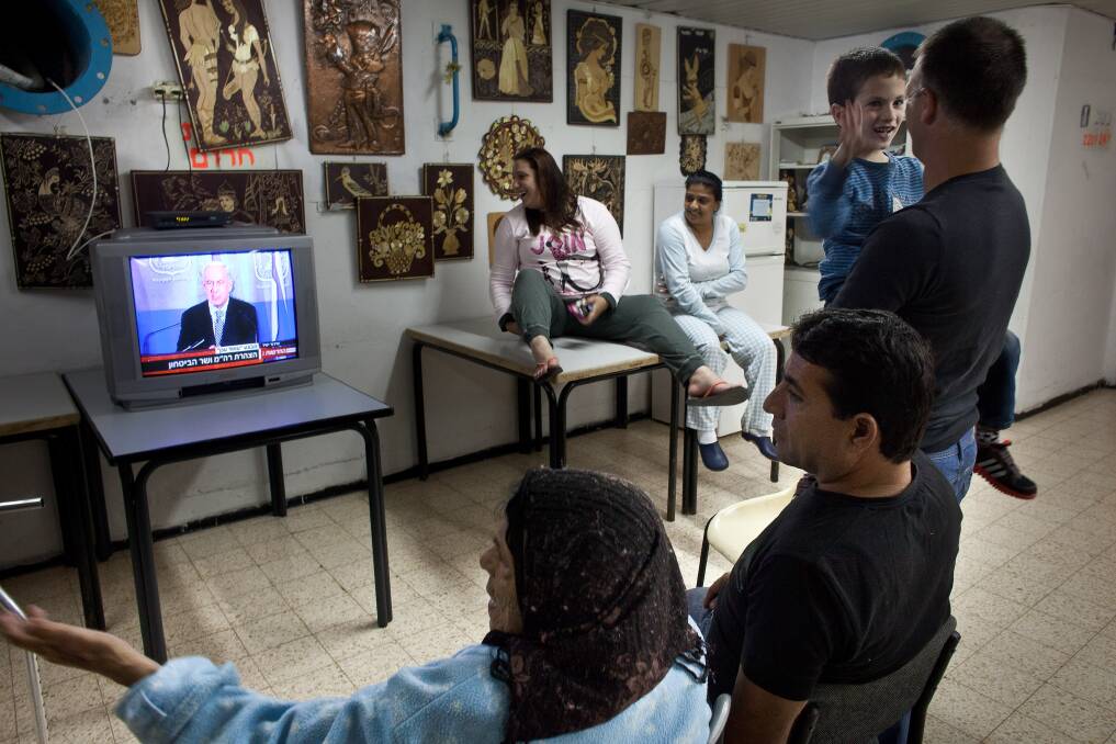 Israelis watch Israeli PM Benjamin Netanyahu on TV in a bomb shelter on November 14, 2012 in Netivot, Israel. Photo by Uriel Sinai/Getty Images