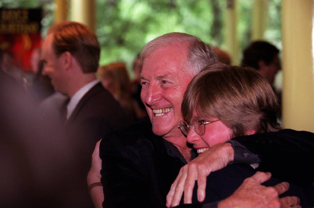 Bryce Courtenay embraces a friend at one of his book launches. Photo: Simon O'Dwyer 
