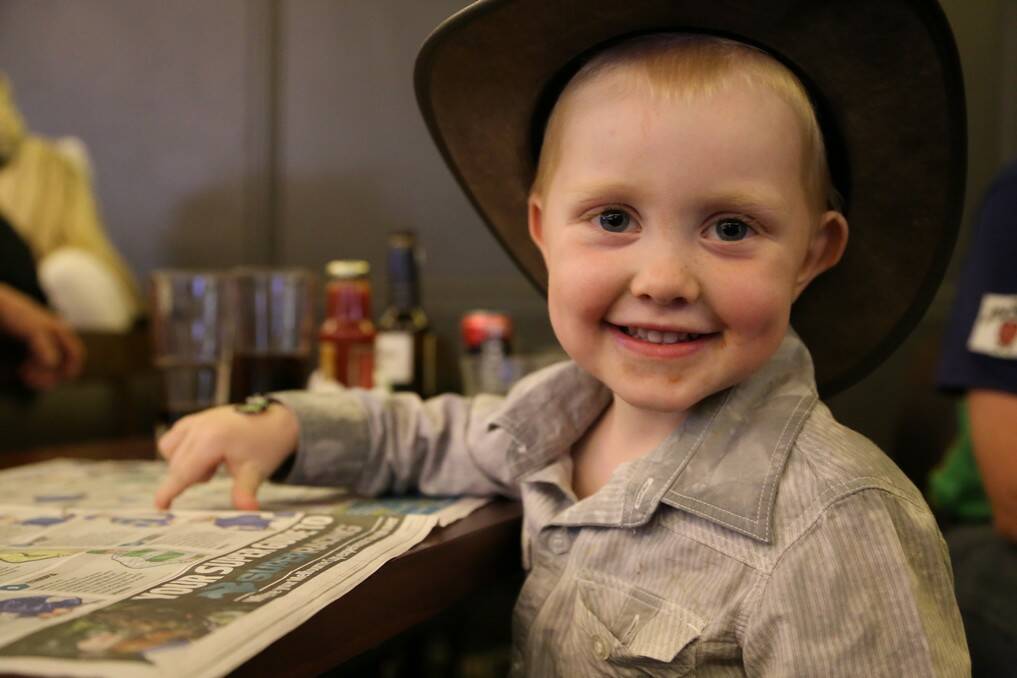 Sutton's Travis Wilson, 3, tries to pick a winner for the Melbourne Cup. 