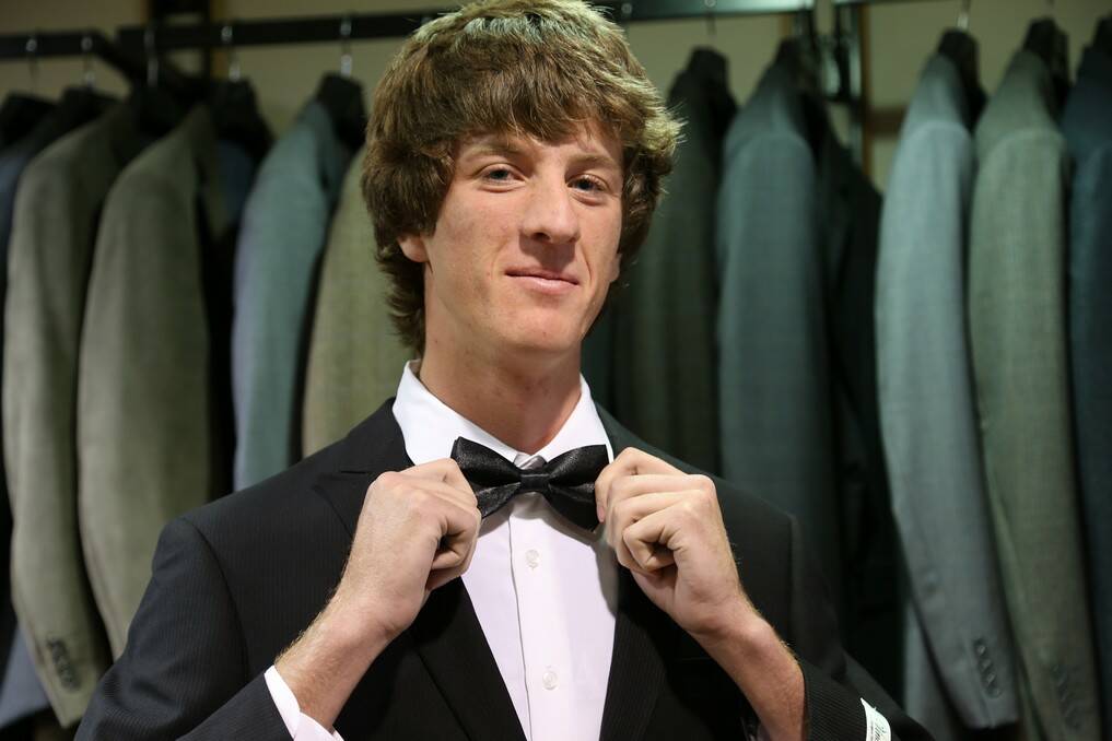 Queanbeyan High School year 12 student Norman Lembit prepares for the year 12 formal.