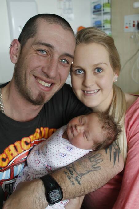 Queanbeyan couple Lachlan Scotford and Jodi Sharp with Poppie Honor Scotford born on July 31.