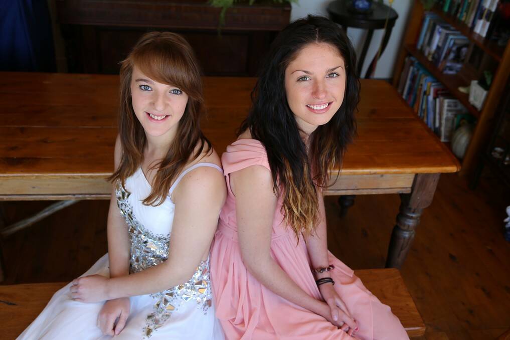 Queanbeyan High School students Stephanie Rayment and Jessie White in their year 12 formal dresses.