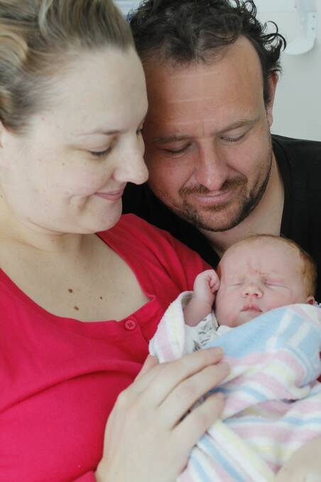 Queanbeyan parents Kylie McGlashan and Tony Fleming with their first born baby girl.