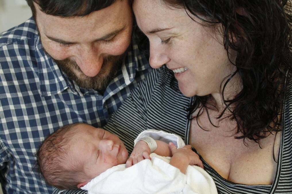Jerrabomberra parents Sean Johnson and Leonie Cook with their son Thomas Raymond Johnson born on May 17.
