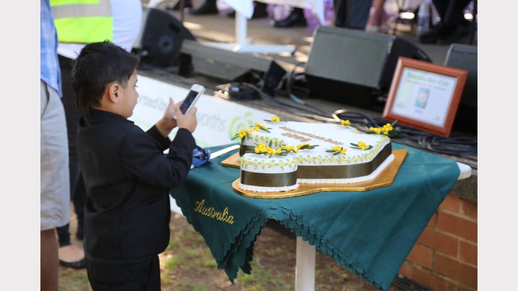 Samnit Singh snaps a photo of the Australia Day cake.