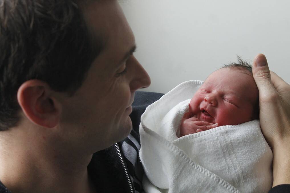 Bungendore father Jeremy Ritcher with baby Emilia Grace born on July 16. Little sister to Aaron and Huxley.